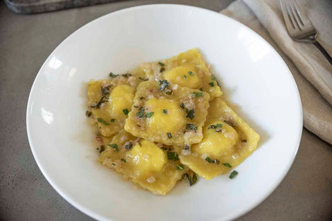 Mushroom Ravioli with Lemon Eshallot & Parmesan Butter Sauce